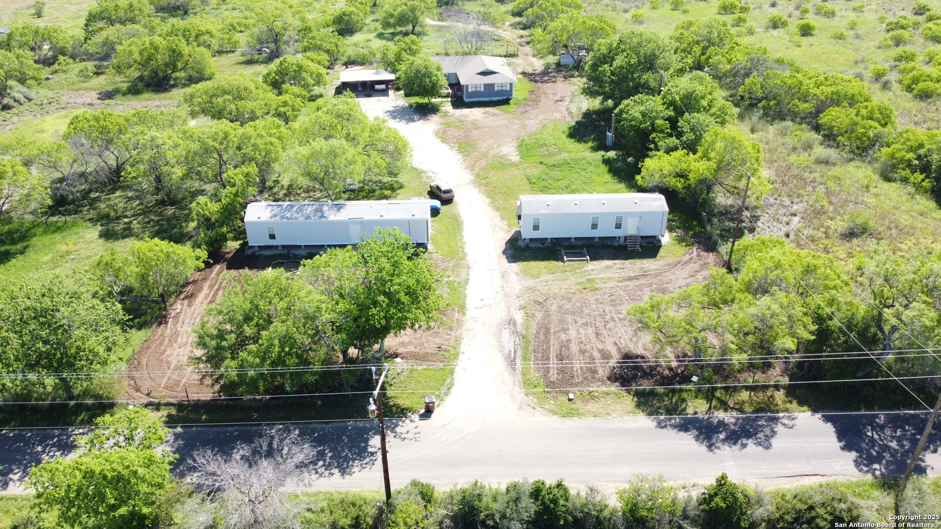 18234 Benton City Road Von Ormy, TX 78073 - Photo 24 of 25 an aerial view of a house with a yard