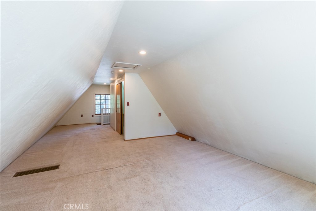26370 Alpine Lane Twin Peaks, CA 92391 - Photo 17 of 37 an empty room with a hallway