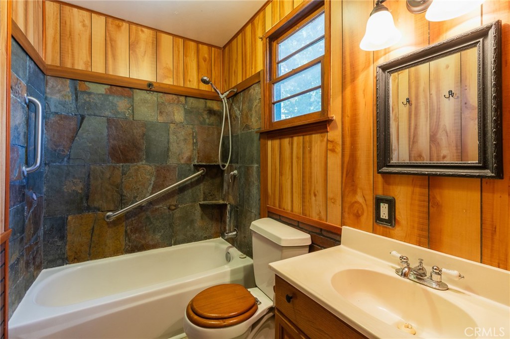 26370 Alpine Lane Twin Peaks, CA 92391 - Photo 21 of 37 a bathroom with a sink a toilet and shower