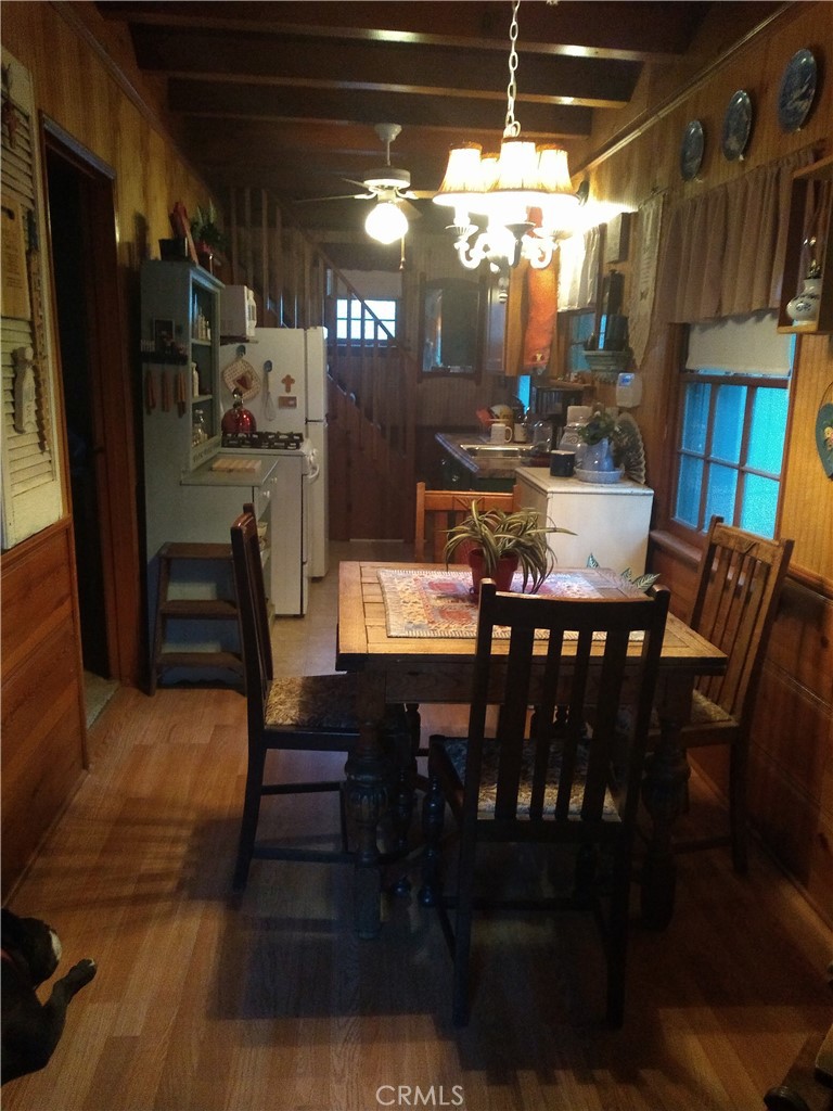 26370 Alpine Lane Twin Peaks, CA 92391 - Photo 31 of 37 a view of a dining room with furniture