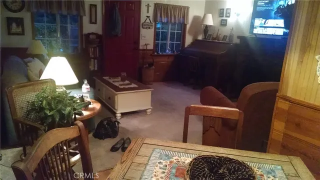 a bedroom with a bed and a mirror