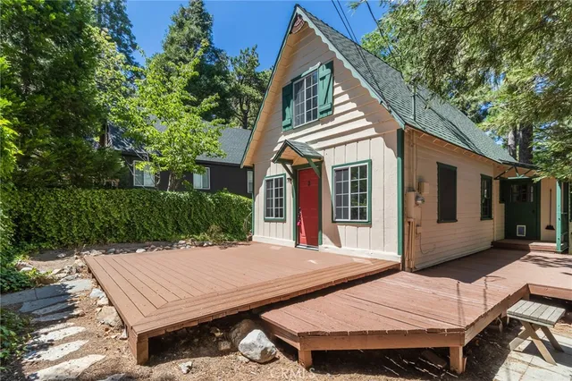 a view of a patio with table and chairs and floor to ceiling window