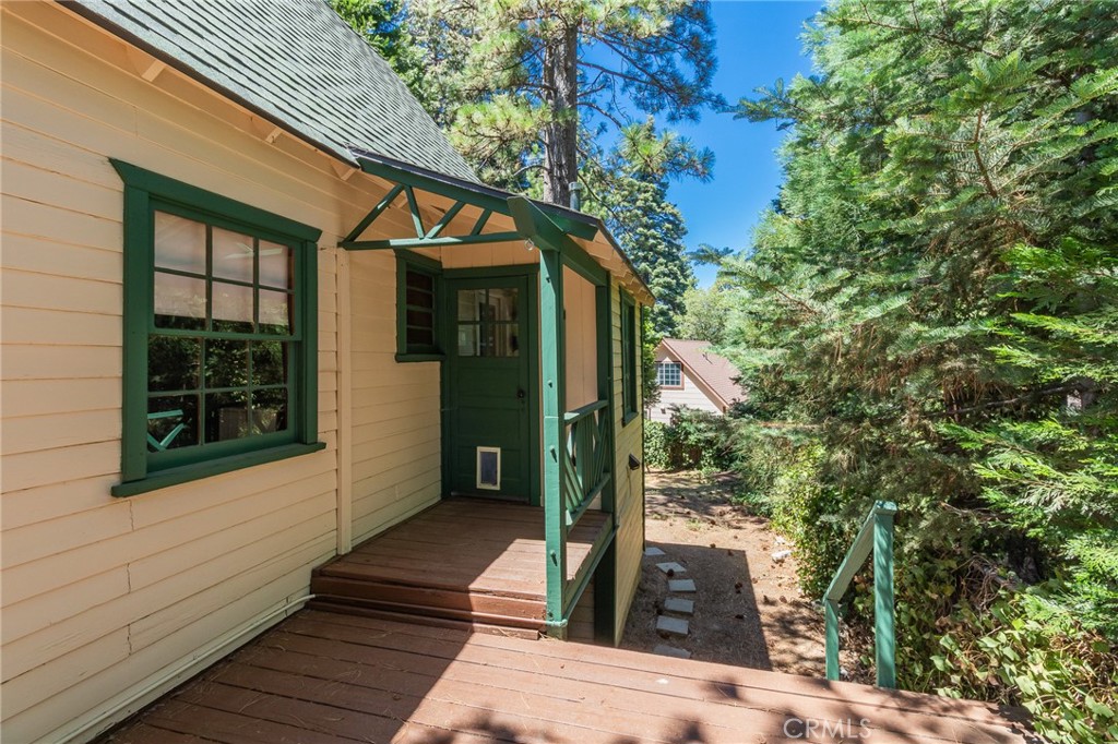26370 Alpine Lane Twin Peaks, CA 92391 - Photo 5 of 37 a porch with seating space and yard in back