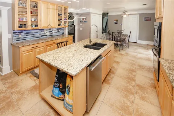 a view of a dining room with furniture and chandelier