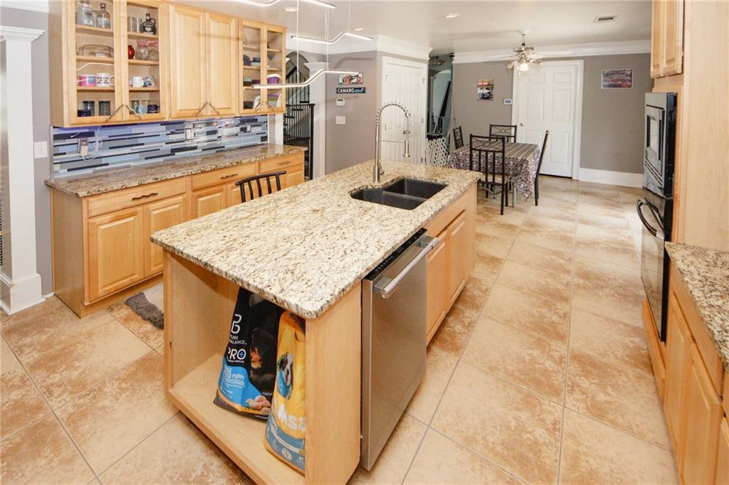 1120 Carl-Bethlehem Road Winder, GA 30680 - Photo 16 of 57 a kitchen with a sink and cabinets