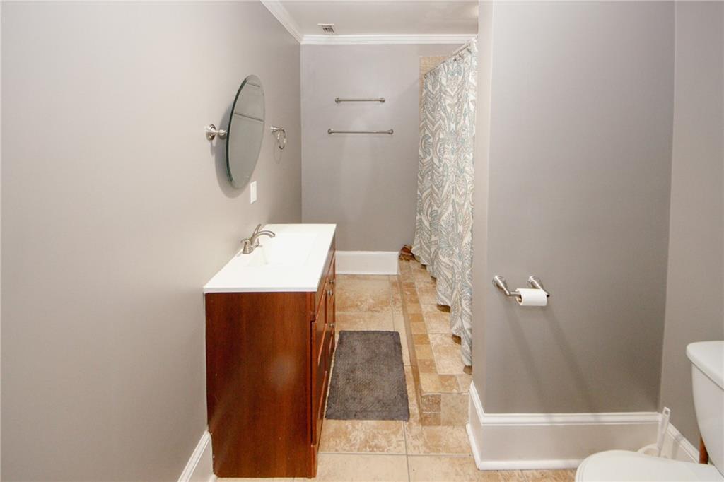 1120 Carl-Bethlehem Road Winder, GA 30680 - Photo 22 of 57 a bathroom with a sink toilet and shower