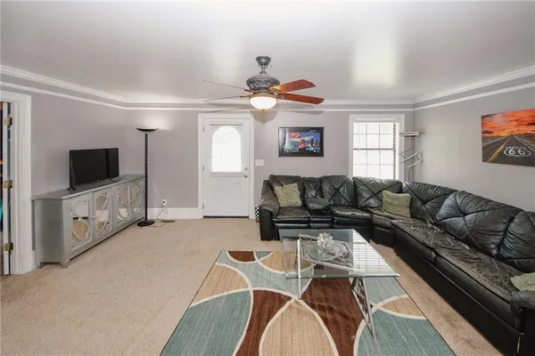 a living room with furniture and a fireplace