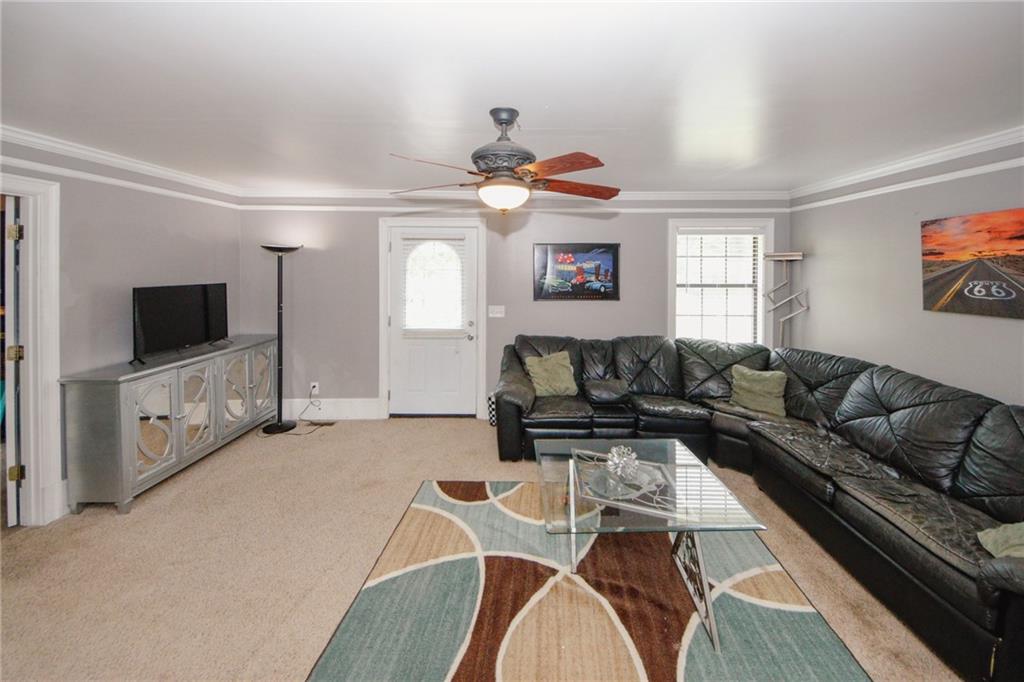 1120 Carl-Bethlehem Road Winder, GA 30680 - Photo 25 of 57 a living room with furniture and a flat screen tv