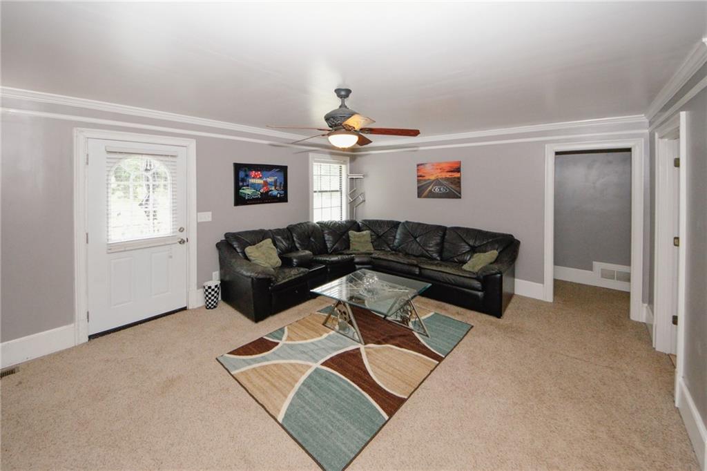 1120 Carl-Bethlehem Road Winder, GA 30680 - Photo 26 of 57 a living room with furniture and a window