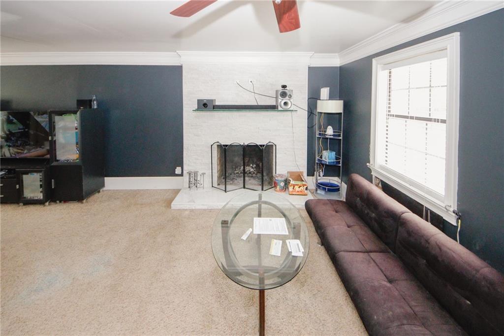 1120 Carl-Bethlehem Road Winder, GA 30680 - Photo 28 of 57 a living room with furniture and a fireplace