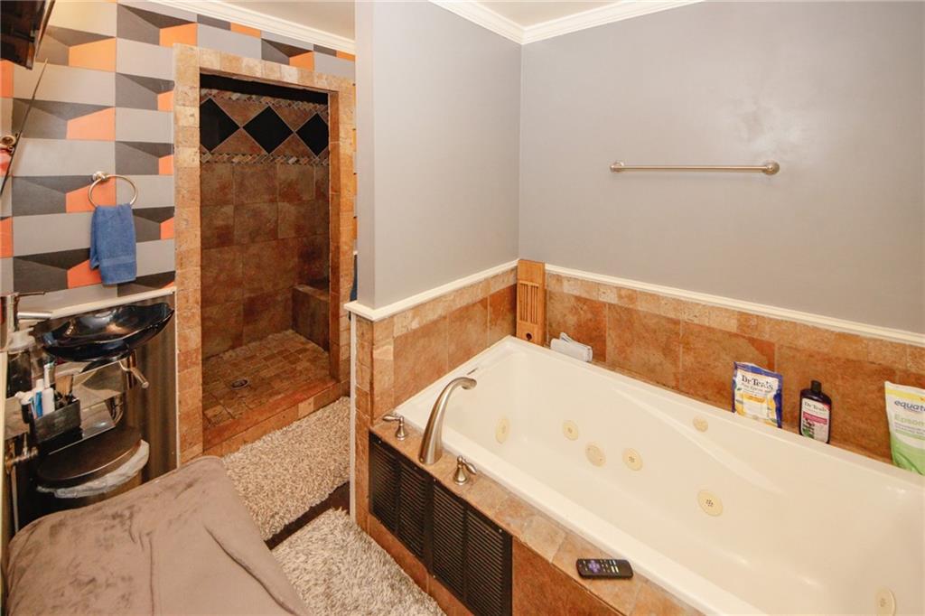 1120 Carl-Bethlehem Road Winder, GA 30680 - Photo 33 of 57 a bathroom with a tub and shower