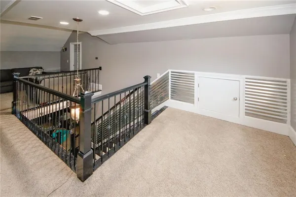 a view of a livingroom with furniture and a flat screen tv