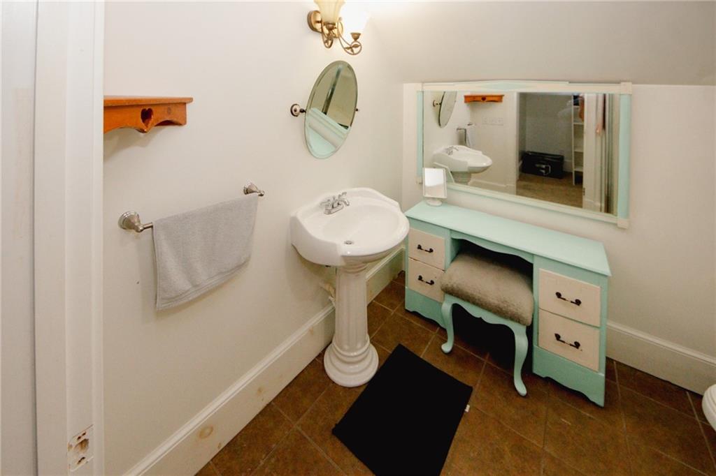 1120 Carl-Bethlehem Road Winder, GA 30680 - Photo 50 of 57 a room with a desk and mirror