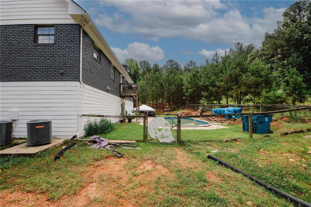 1120 Carl-Bethlehem Road Winder, GA 30680 - Photo 5 of 57 a view of a backyard with swimming pool