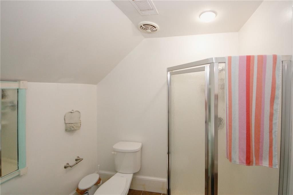 1120 Carl-Bethlehem Road Winder, GA 30680 - Photo 51 of 57 a bathroom with a shower a toilet and sink