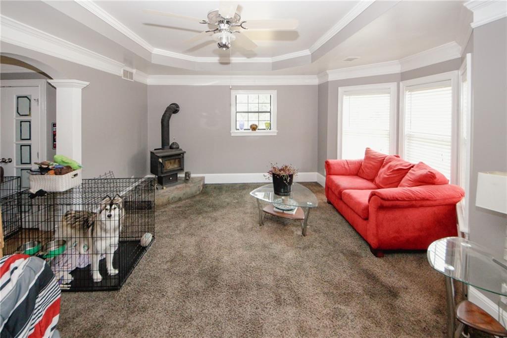 1120 Carl-Bethlehem Road Winder, GA 30680 - Photo 9 of 57 a living room with furniture a window and a flat screen tv