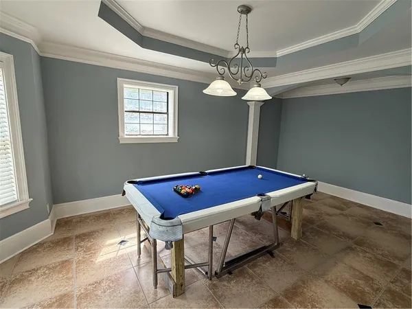 a kitchen with stainless steel appliances kitchen island granite countertop a refrigerator and stove