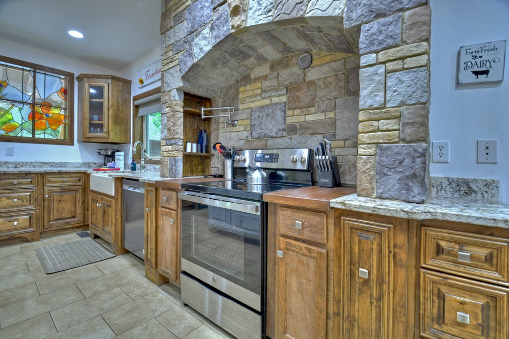 300 Forest Drive Morganton, GA 30560 - Photo 13 of 73 Stone Arch over Range w/Pot Filler