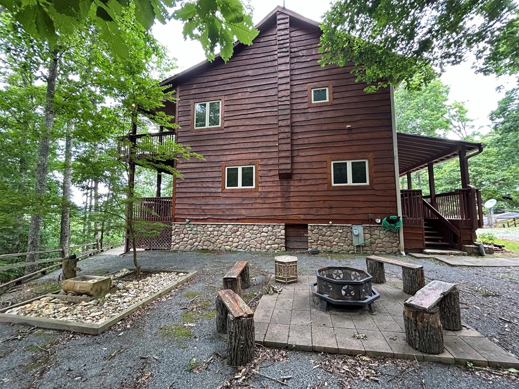 300 Forest Drive Morganton, GA 30560 - Photo 56 of 73 Side Elevation w/Firepit and Water Feature