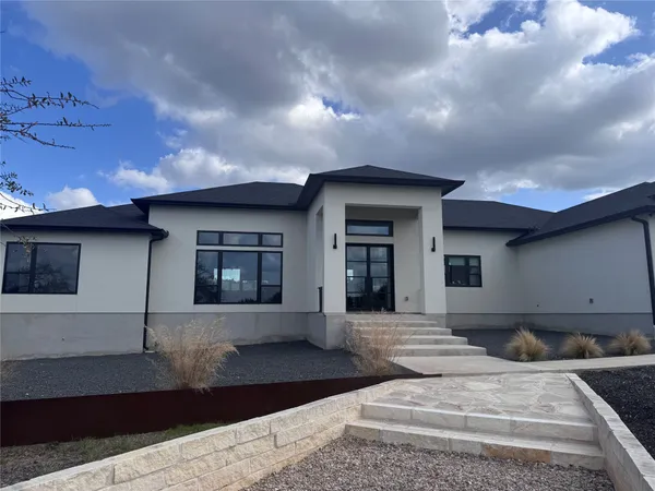 a front view of a house with yard