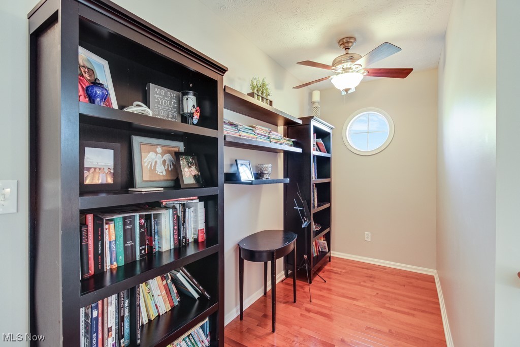 132 Timber Ridge Drive, Unit RDR Elyria, OH 44035 - Photo 20 of 41 Home office featuring a textured ceiling, wood-type flooring, and ceiling fan