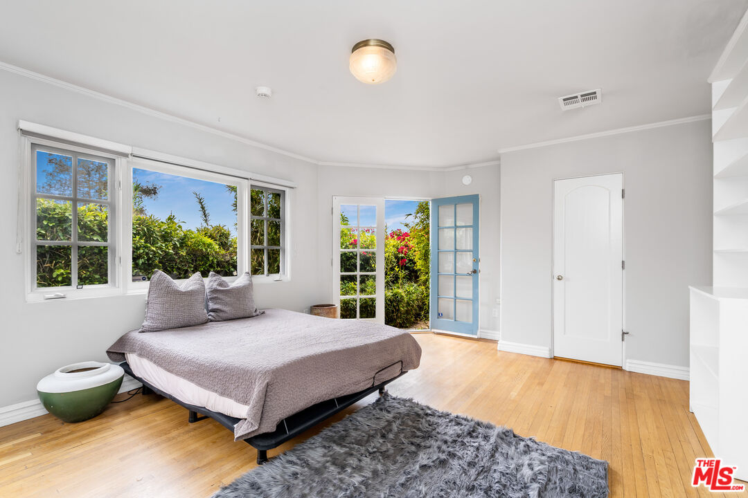 2125 Rockledge Road Los Angeles, CA 90068 - Photo 11 of 21 a bedroom with a bed and a large window