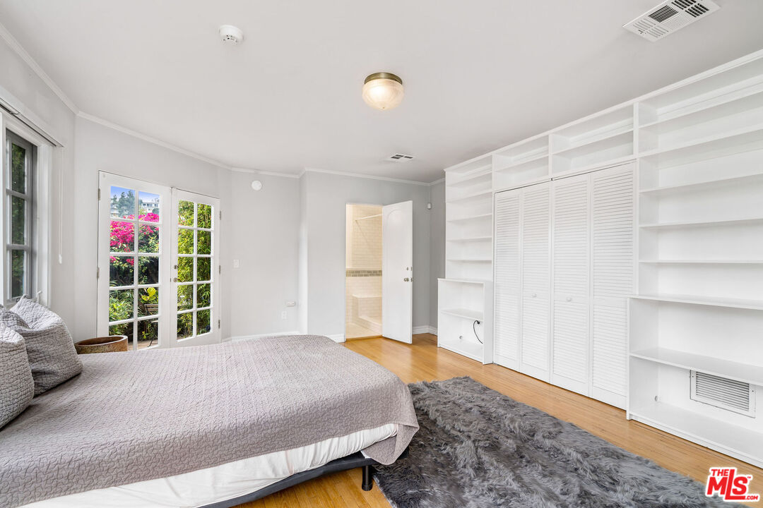 2125 Rockledge Road Los Angeles, CA 90068 - Photo 12 of 21 a bedroom with a bed and a window