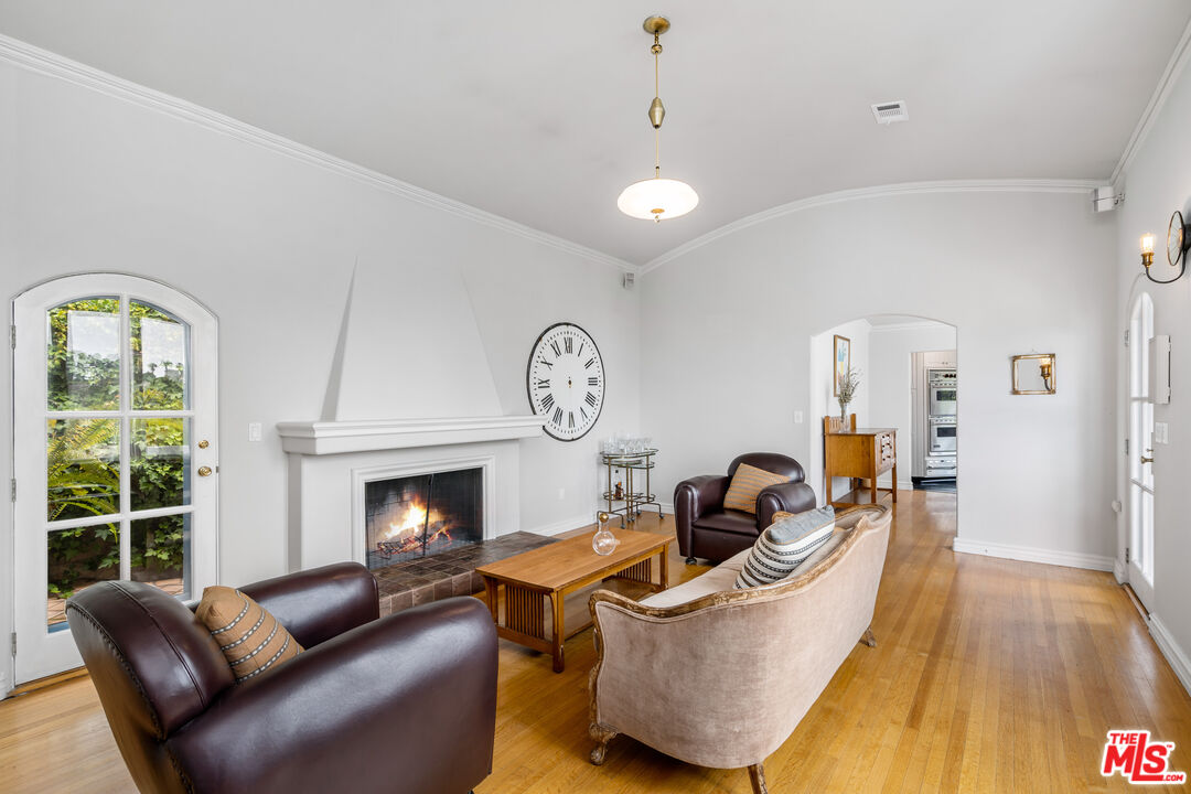 2125 Rockledge Road Los Angeles, CA 90068 - Photo 2 of 21 a living room with furniture and a fireplace