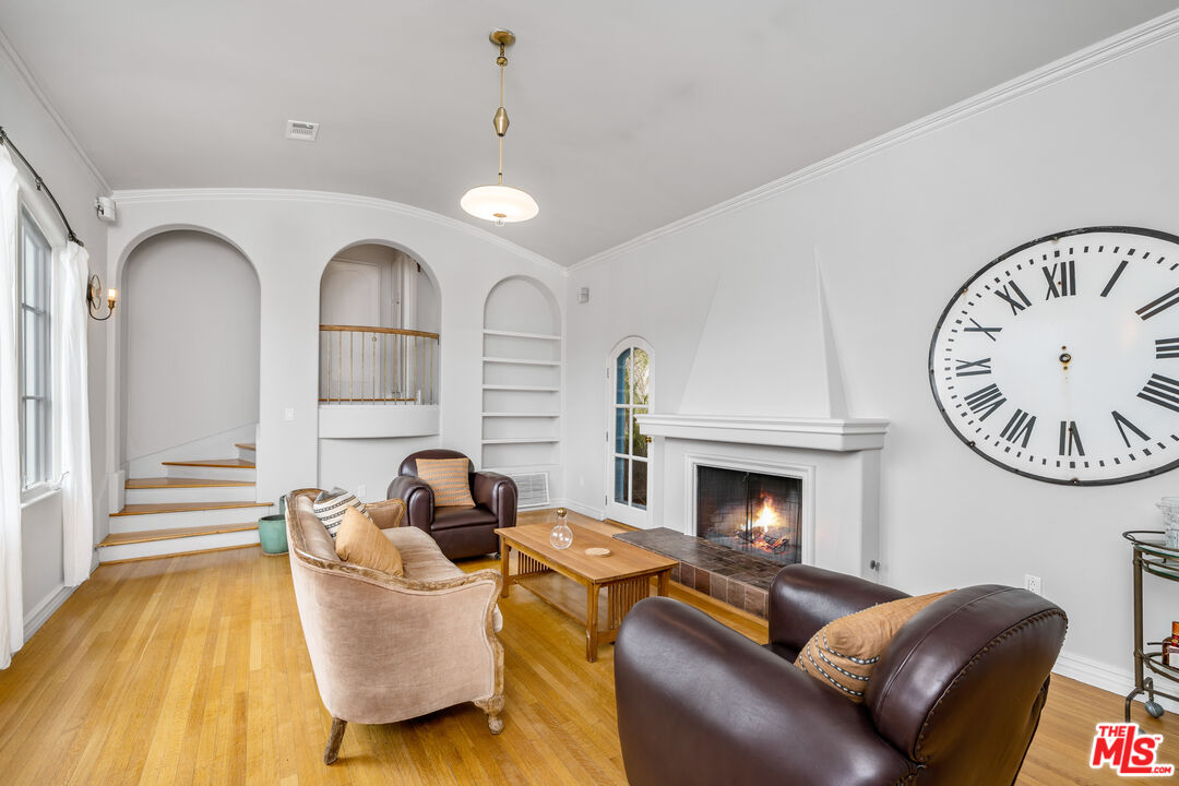 2125 Rockledge Road Los Angeles, CA 90068 - Photo 3 of 21 a living room with furniture and a fireplace