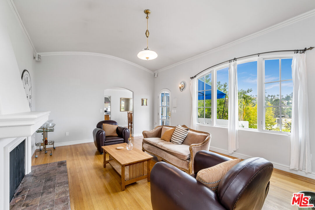 2125 Rockledge Road Los Angeles, CA 90068 - Photo 4 of 21 a living room with furniture and a fireplace