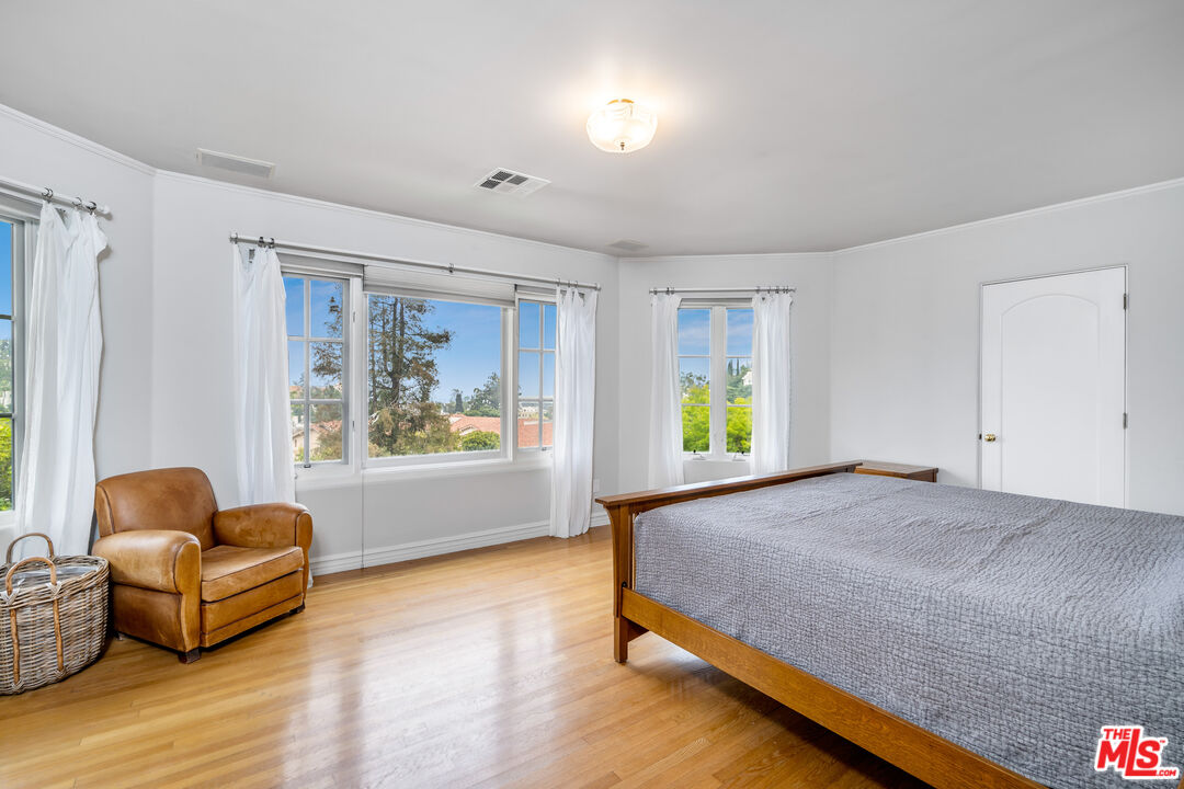 2125 Rockledge Road Los Angeles, CA 90068 - Photo 8 of 21 a bedroom with furniture and a large window