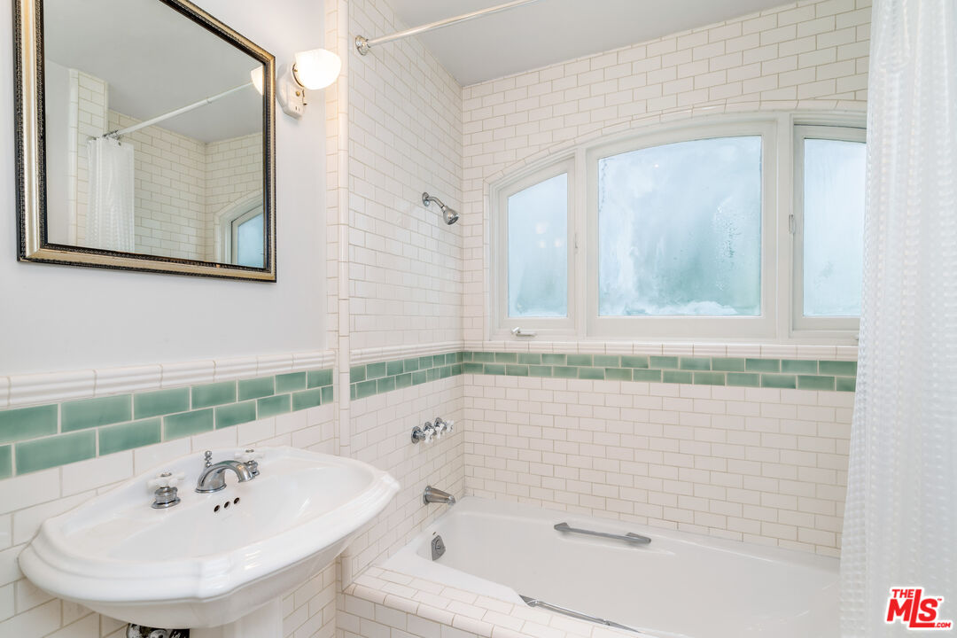 2125 Rockledge Road Los Angeles, CA 90068 - Photo 10 of 21 a bathroom with a bathtub and a sink