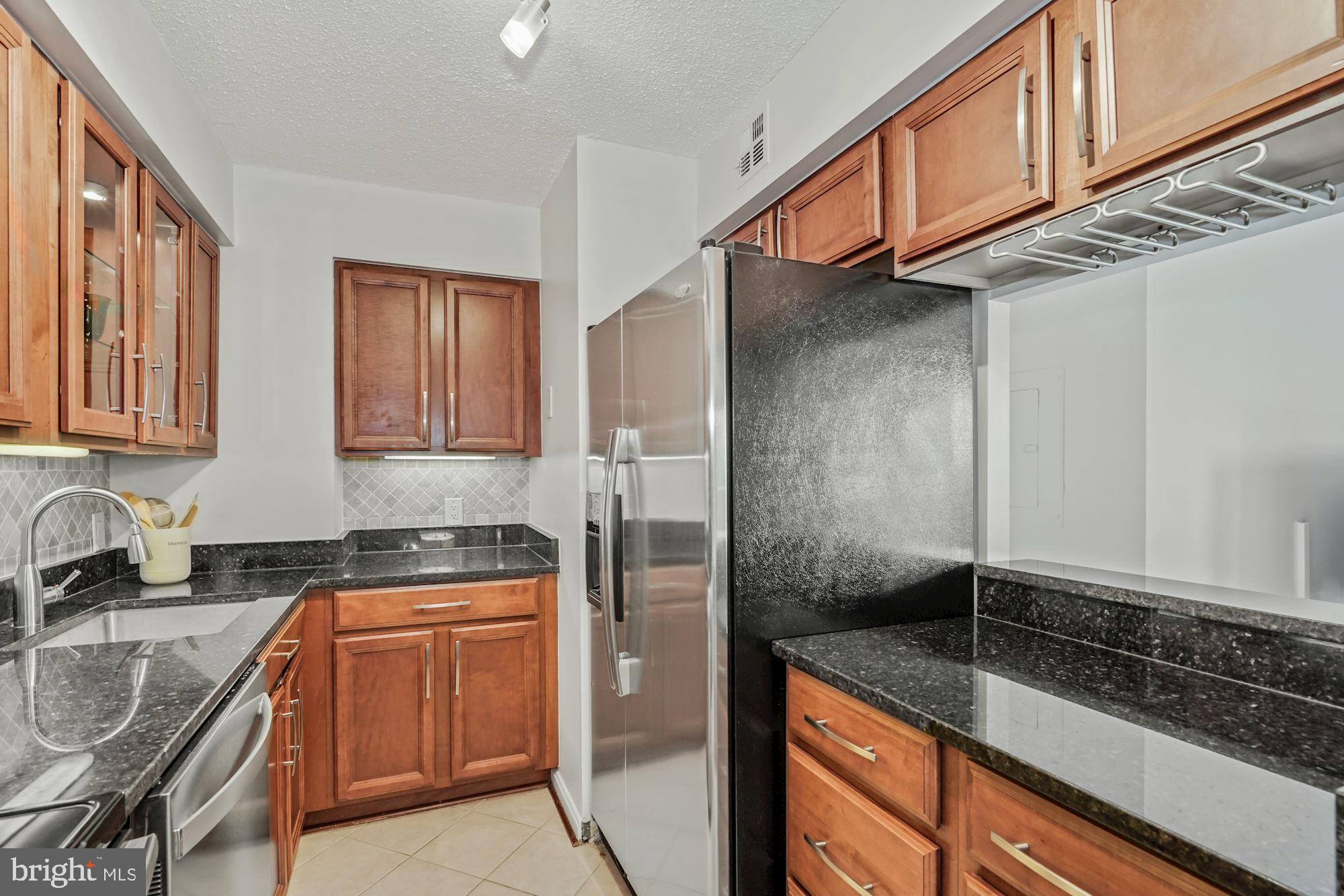 1301 North Courthouse Road, Unit 801 Arlington, VA 22201 - Photo 14 of 31 Kitchen open pass-through to the living room