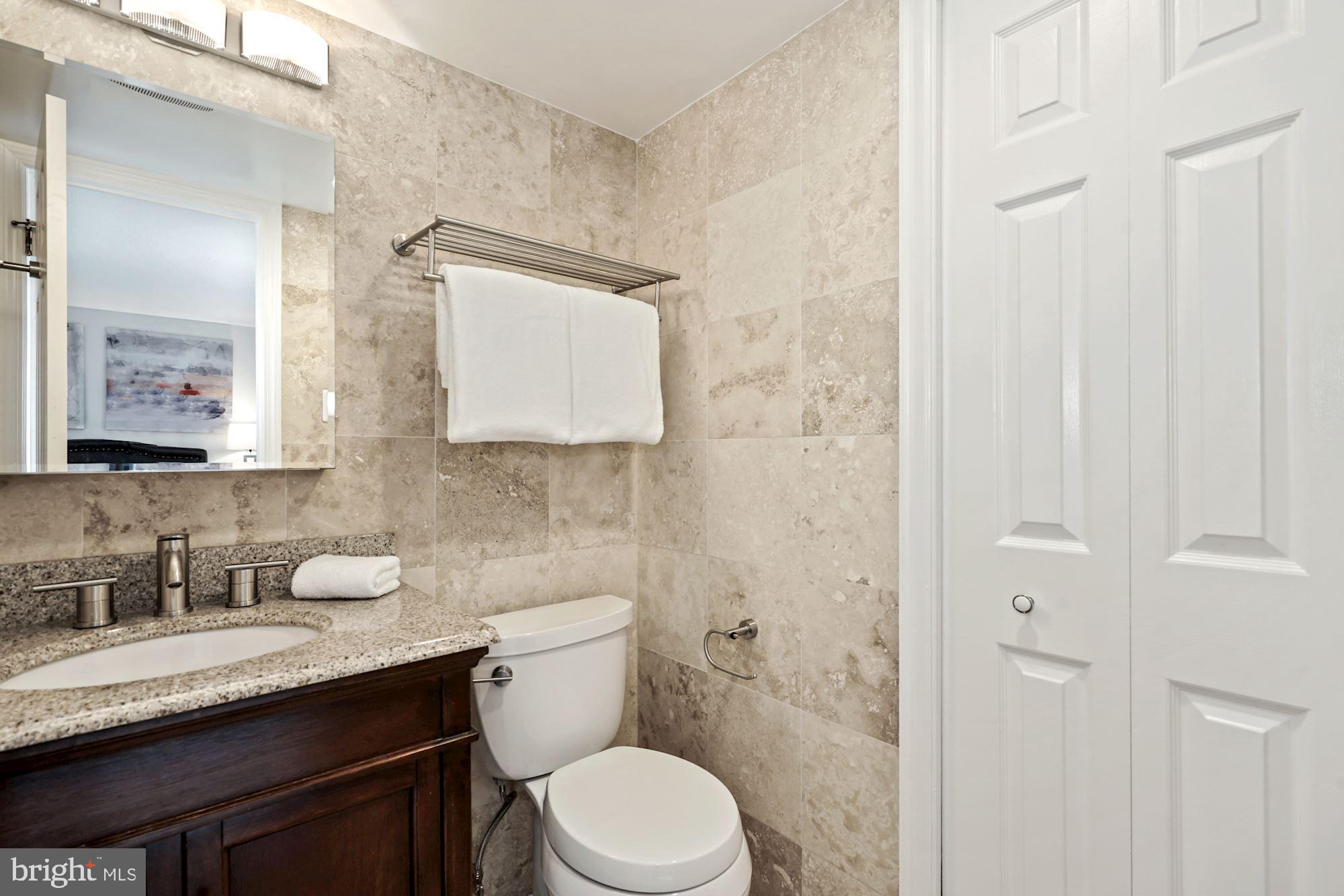 1301 North Courthouse Road, Unit 801 Arlington, VA 22201 - Photo 19 of 31 Owner's bath w/granite-top vanity & linen closet