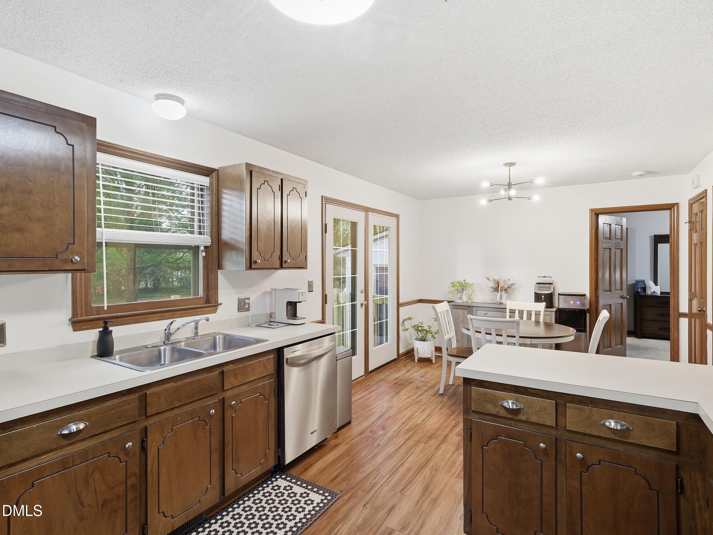 517 Lake Glad Road Wendell, NC 27591 - Photo 12 of 36 a kitchen with a sink appliances and cabinets