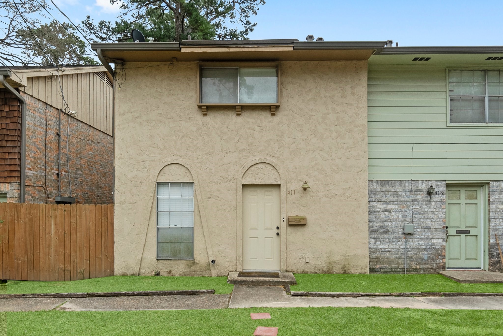 407 West Semands Street Conroe, TX 77301 - Photo 6 of 28 a front view of a house with a garden