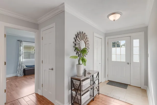 a view of an entryway with wooden floor