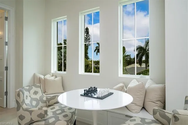 a dining room with furniture and window