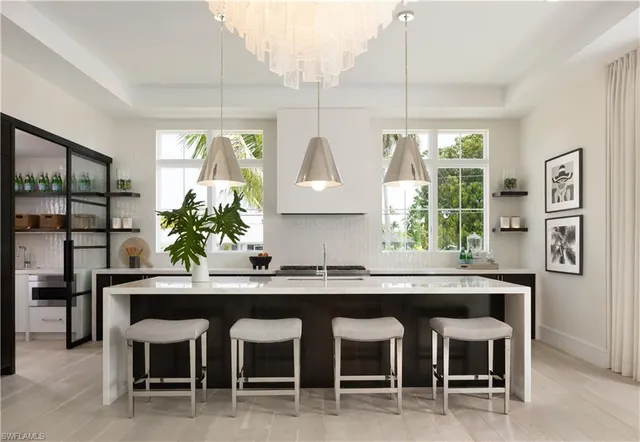 a kitchen with a table and chairs in it