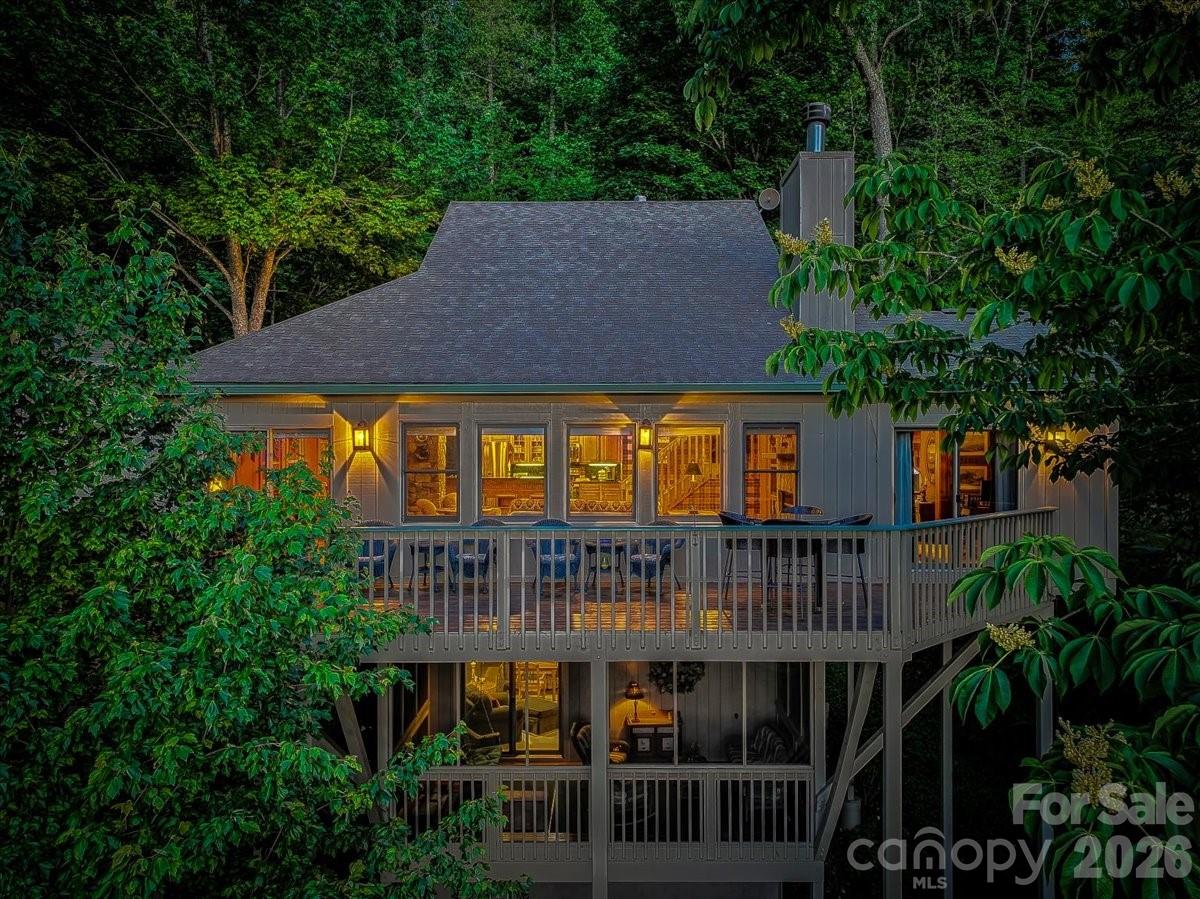 121 Ivy Ridge Road Burnsville, NC 28714 - Photo 1 of 48 aerial view of a house with roof deck and garden