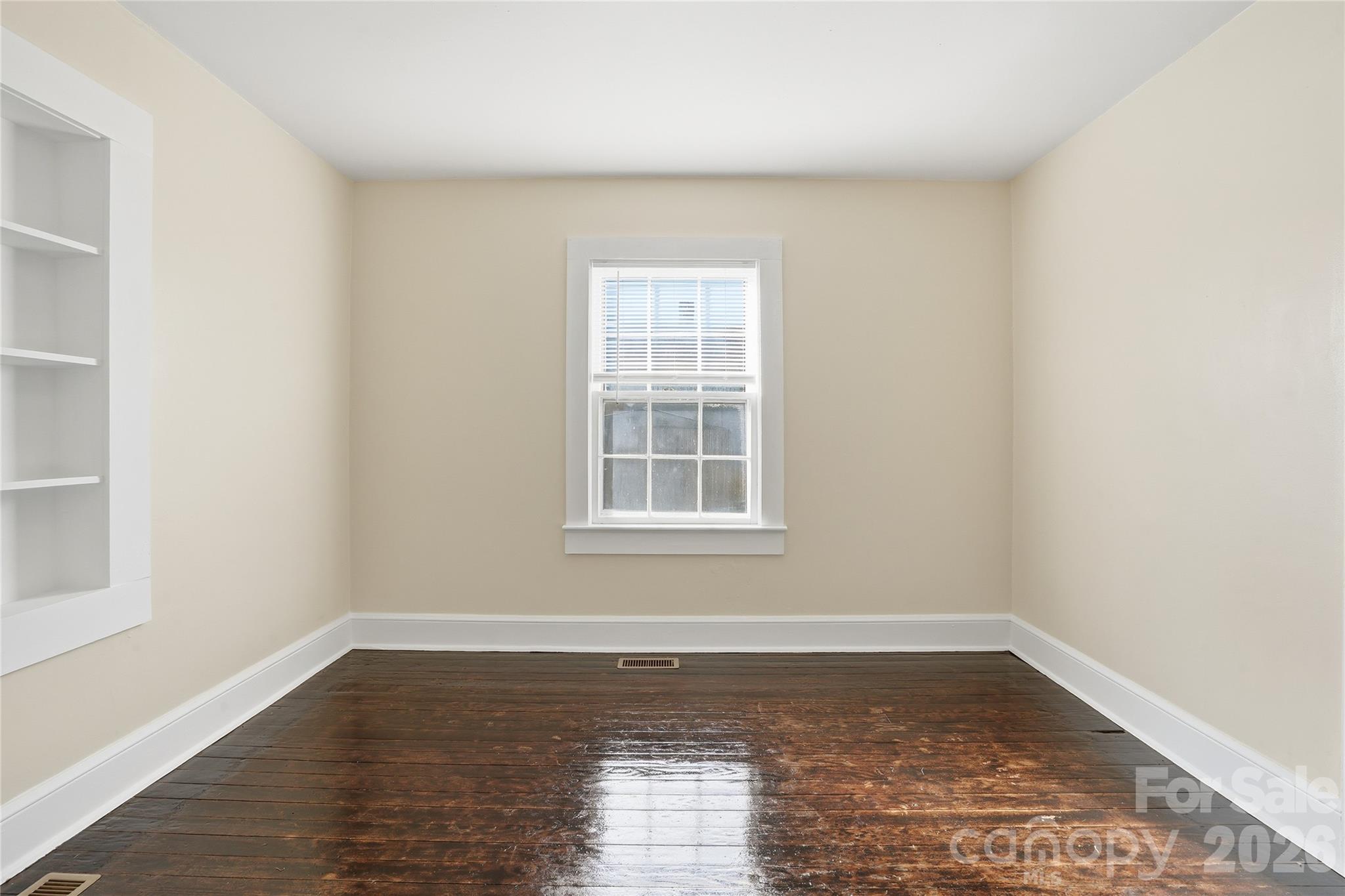 358 North Cleghorn Street Rutherfordton, NC 28139 - Photo 10 of 21 a view of empty room with wooden floor and fan