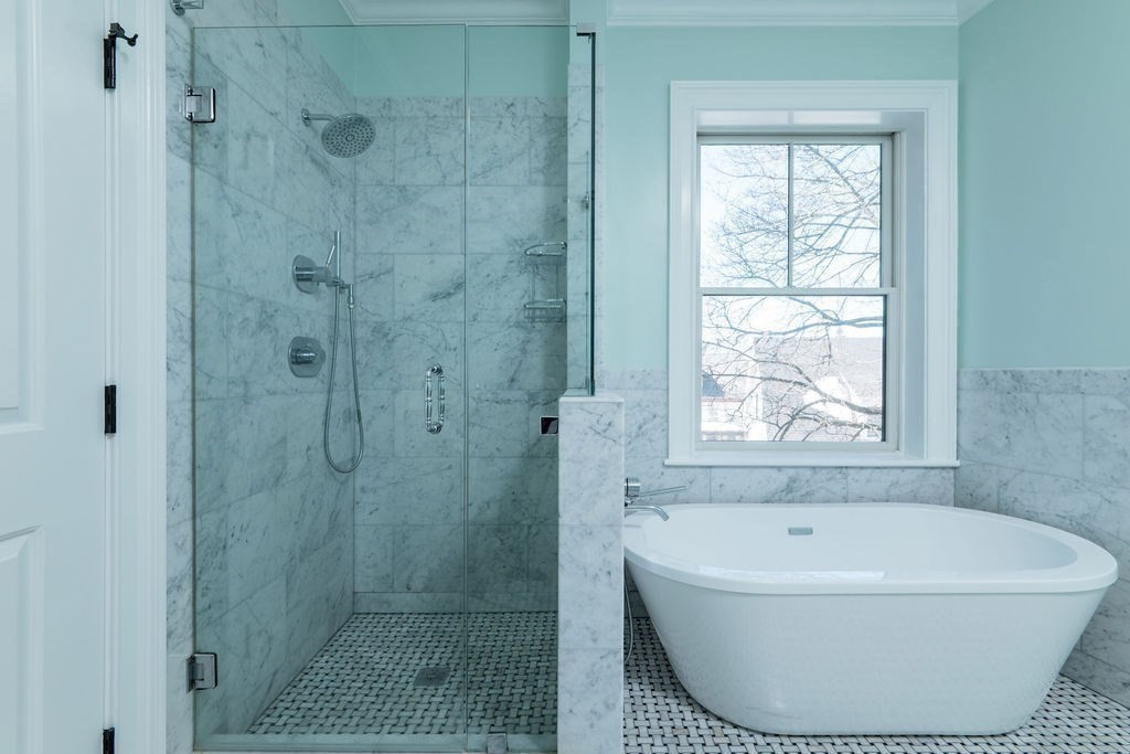142 Fuller Street, Unit 4 Brookline, MA 02446 - Photo 15 of 40 a bathroom with a bathtub and shower