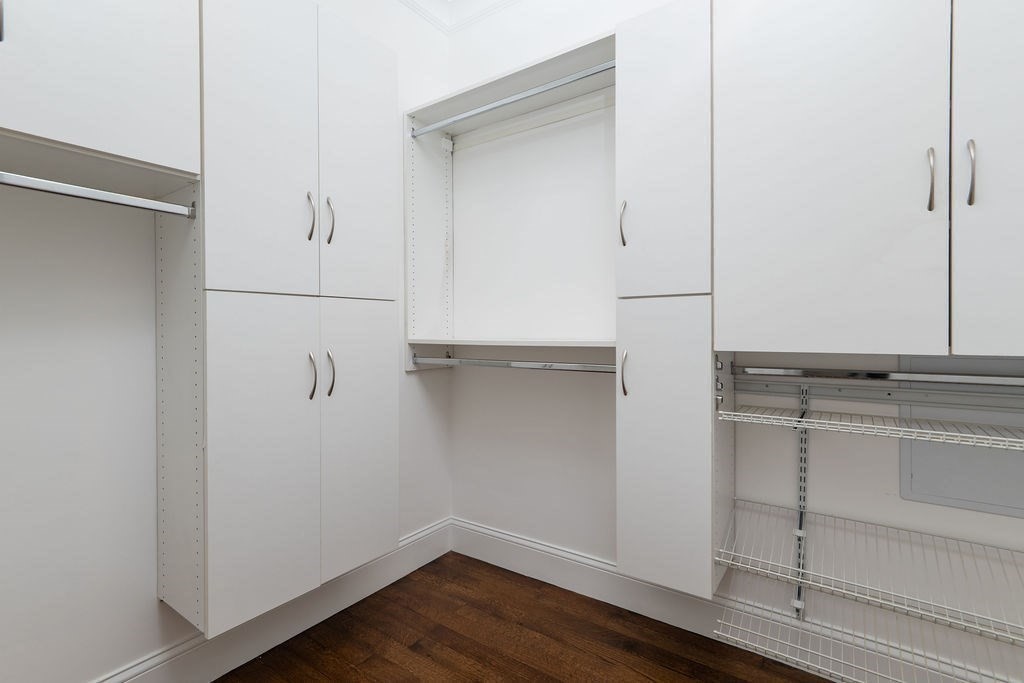 142 Fuller Street, Unit 4 Brookline, MA 02446 - Photo 16 of 40 a view of walk in closet with empty racks