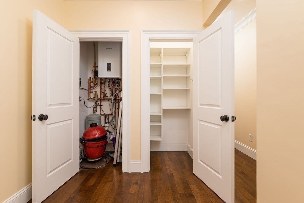 142 Fuller Street, Unit 4 Brookline, MA 02446 - Photo 19 of 40 a view of a room with wooden floor and closet