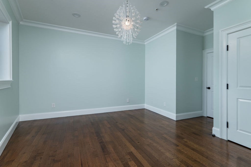 142 Fuller Street, Unit 4 Brookline, MA 02446 - Photo 28 of 40 a view of a chandelier in an empty room