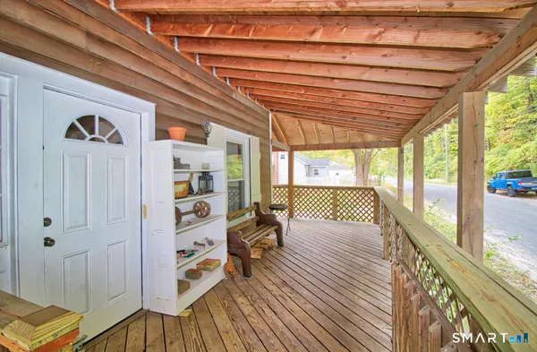 a bedroom with furniture and a large window