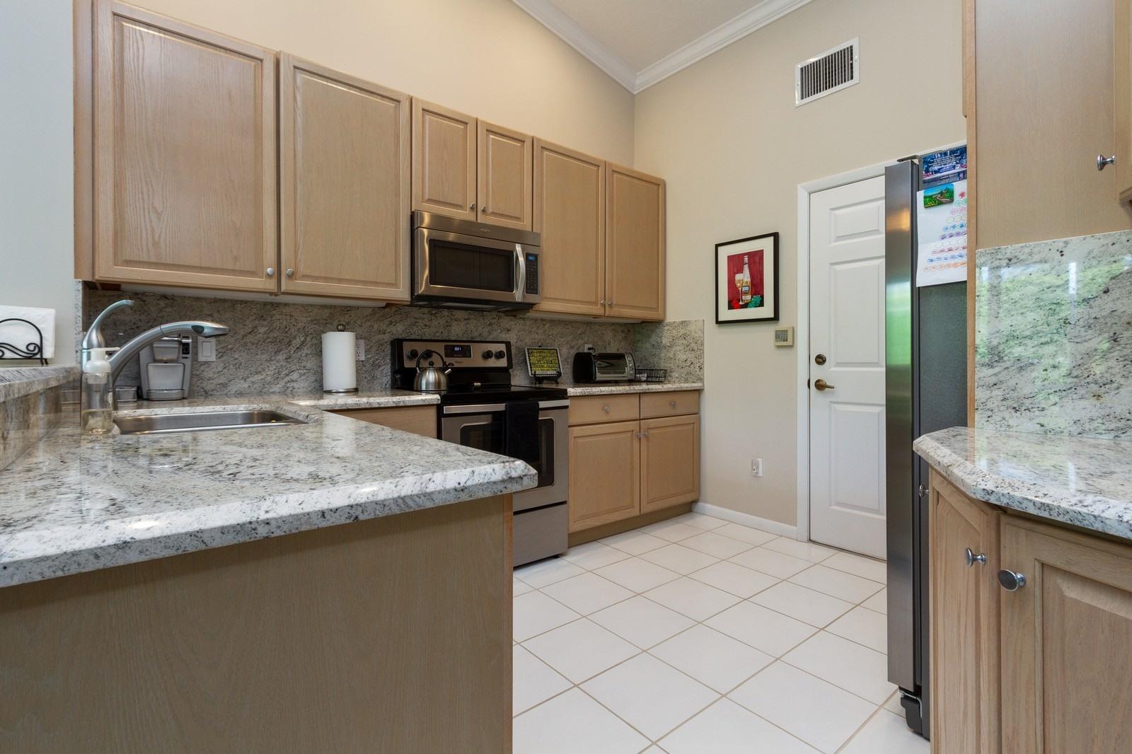 17245 Boca Club Boulevard, Unit 2 Boca Raton, FL 33487 - Photo 6 of 19 05_17245BocaClubBlvd2_5_Kitchen_Custom_R