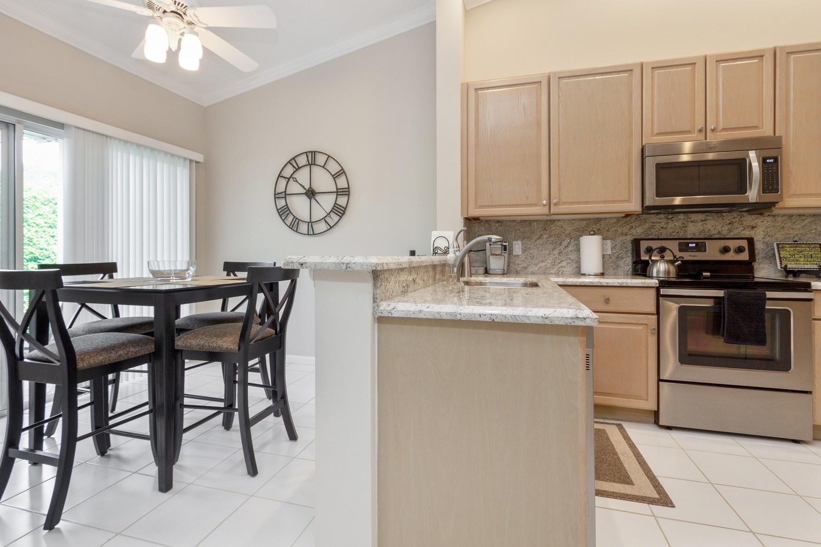 17245 Boca Club Boulevard, Unit 2 Boca Raton, FL 33487 - Photo 9 of 19 08_17245BocaClubBlvd2_191_KitchenBreakfa