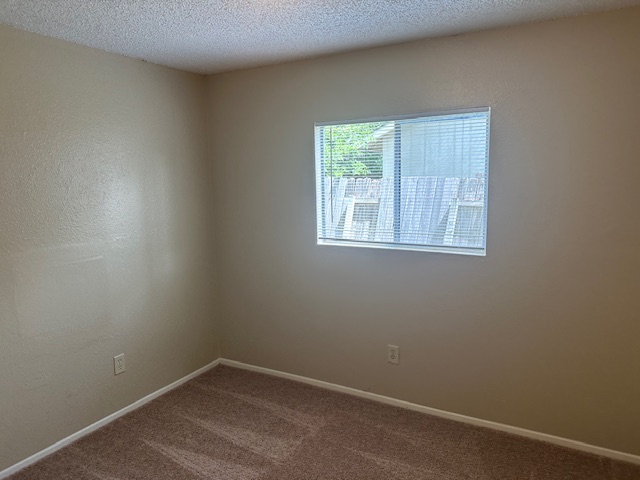 6912 Branchwood Drive, Unit B Austin, TX 78744 - Photo 6 of 11 an empty room with a window