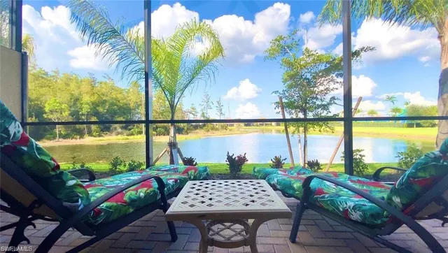 a view of swimming pool with outdoor seating space